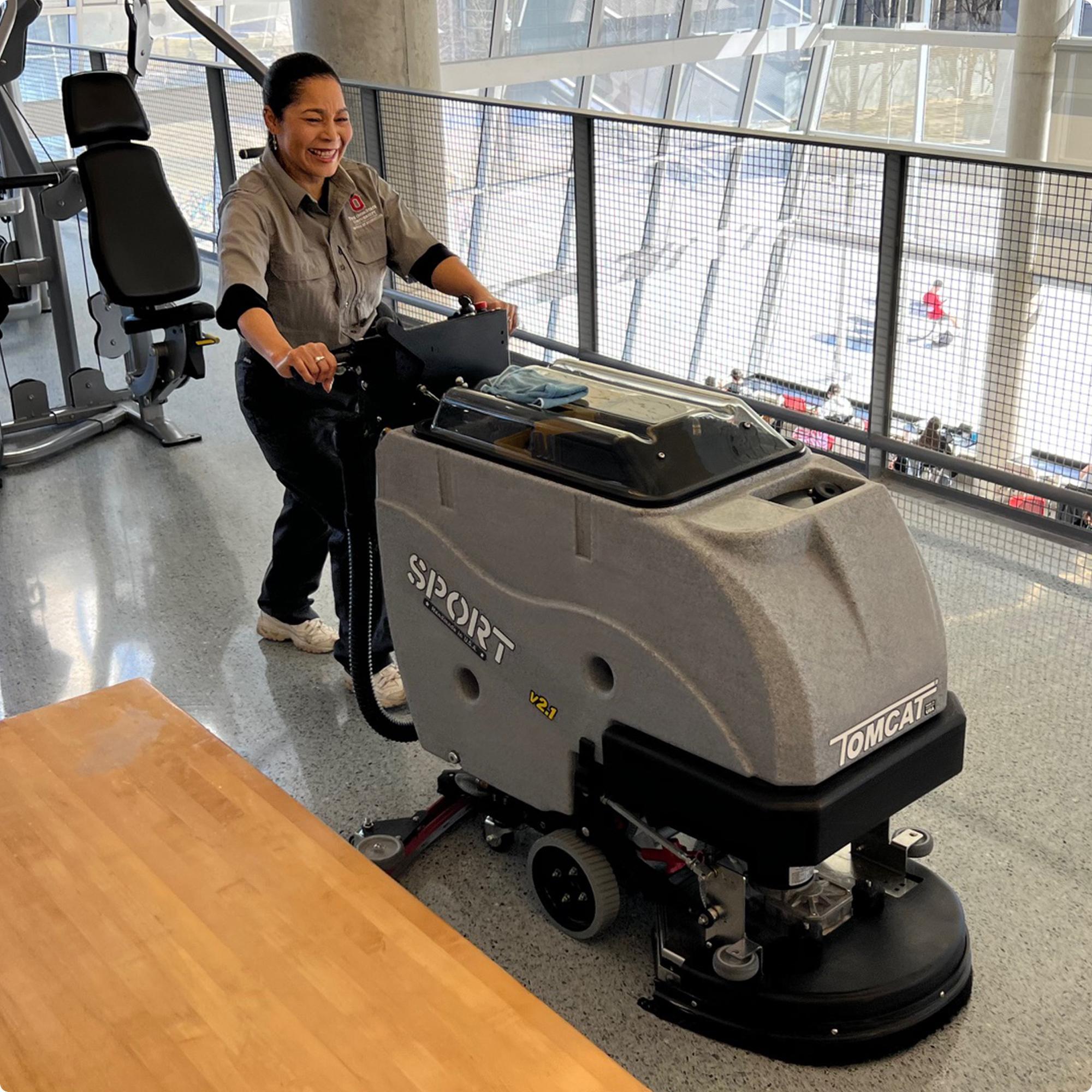 Tomcat SPORT v2.1 20" Disk Deck Floor Scrubber cleaning a terazzo floor in the fitness center of a university IMG00064