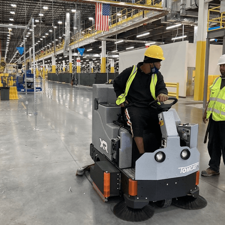 Tomcat floor scrubber showcasing its cleaning power