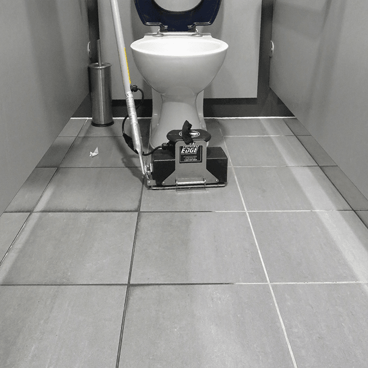 Tomcat floor scrubber showcasing its cleaning power