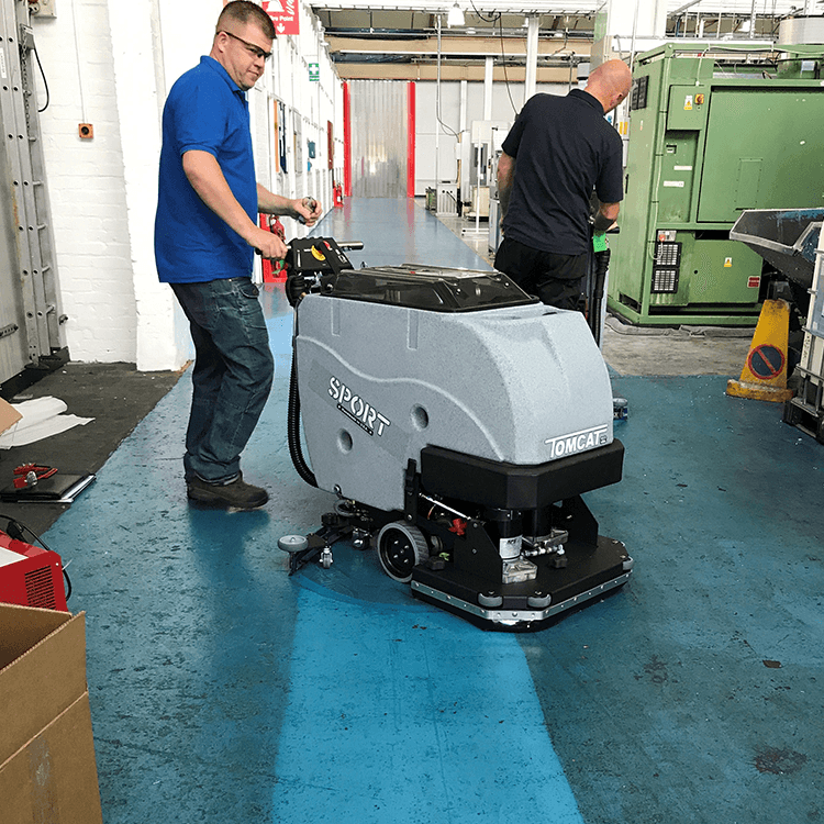 Tomcat floor scrubber showcasing its cleaning power