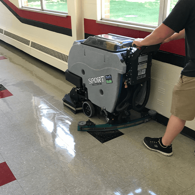 Tomcat floor scrubber showcasing its cleaning power