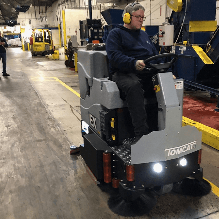 Tomcat floor scrubber showcasing its cleaning power