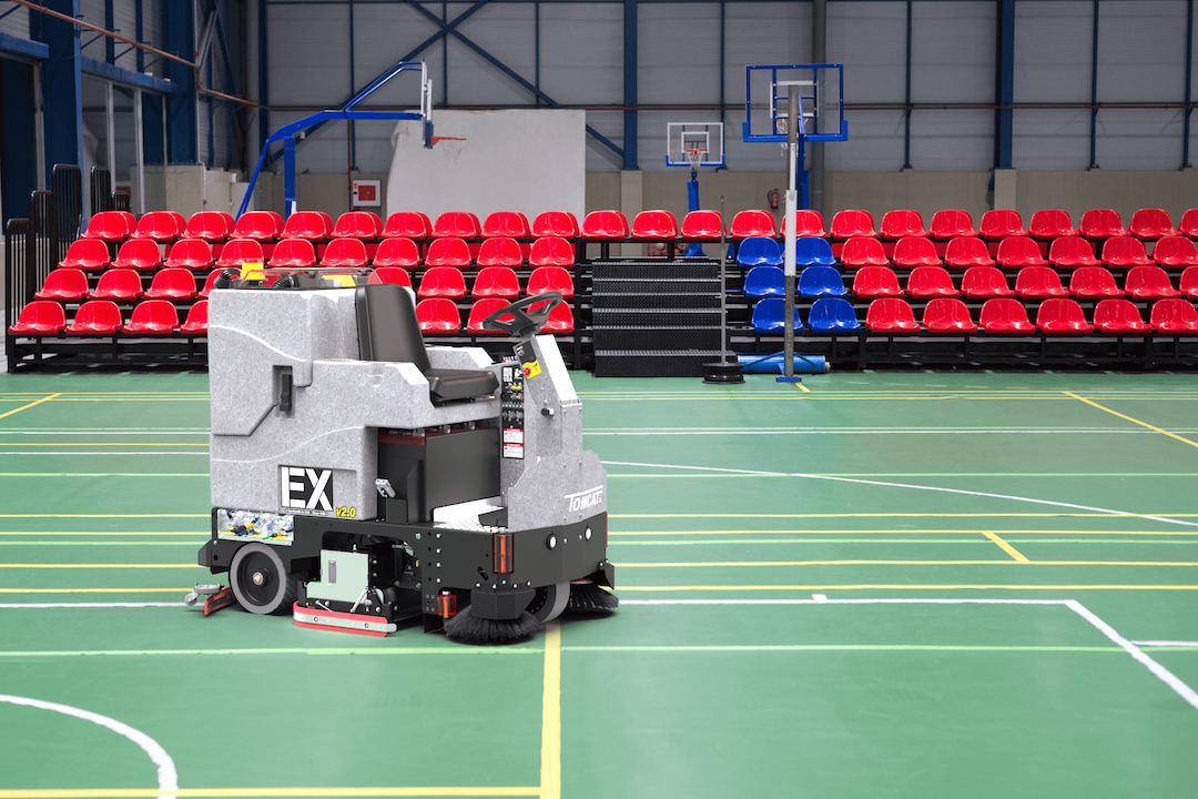 Tomcat showcasing the various applications of their floor scrubbers, in this case, in Gymnasium