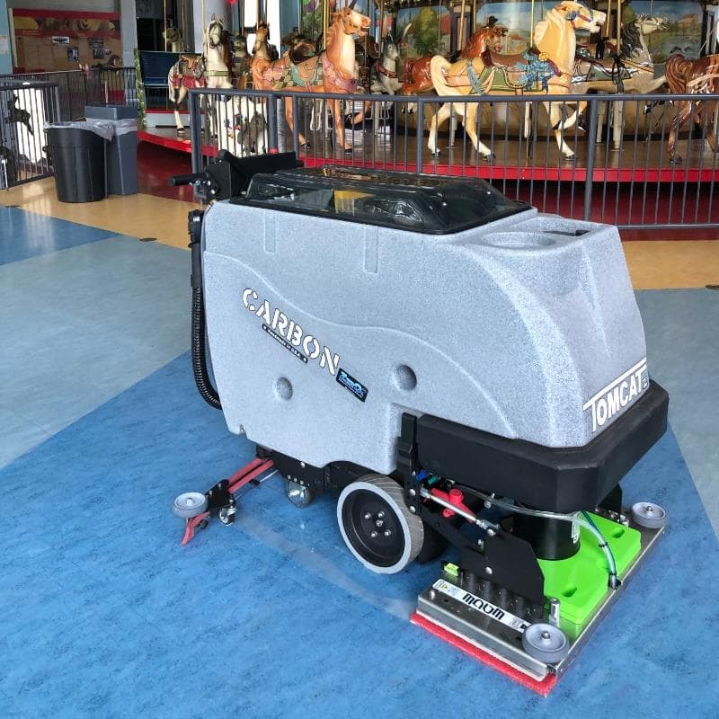Tomcat Walk Behind Floor Scrubbers Carbon high traffic epoxy floors Tomcat CARBON Walk Behind Floor Scrubbers cleaning an epoxy coated floor at an Orlando Florida Amusement Park