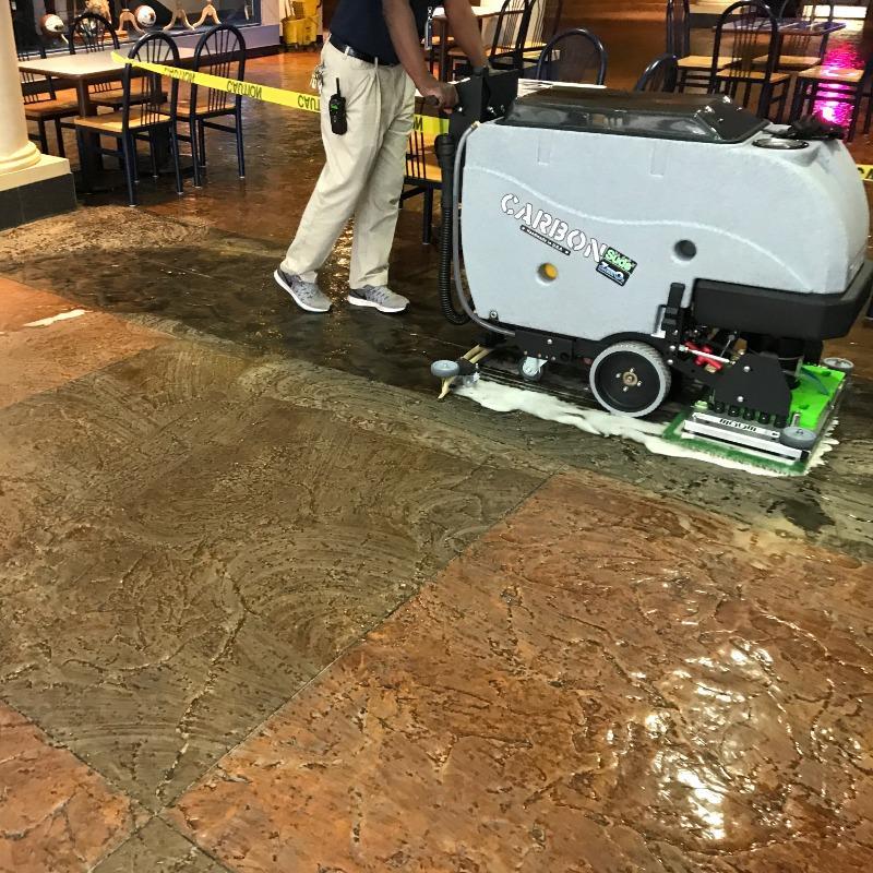 Tomcat Walk Behind Floor Scrubbers Carbon lobby epoxy CARBON Walk Behind Floor Scrubber cleans the epoxy coated stamped concrete in a Las Vegas Casino