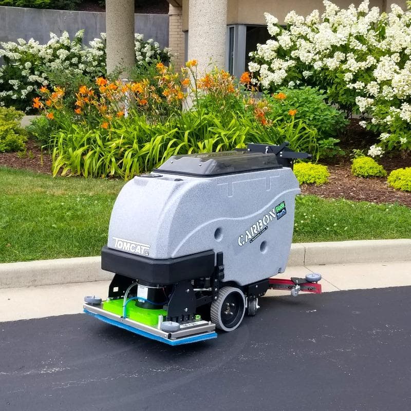Tomcat Walk Behind Floor Scrubbers Carbon parking areas asphalt CARBON Walk Behind Floor Scrubber on an asphalt parking lot at a Grand Rapids, Michigan Convention Center