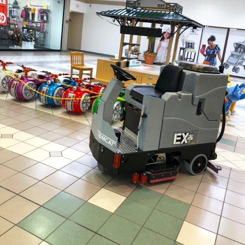 Tomcat Ride On Floor Scrubbers EX atrium ceramic tile A Tomcat EX ride on battery floor scrubber cleaning ceramic tile floors in an atrium of a shopping mall in Rockaway, NJ