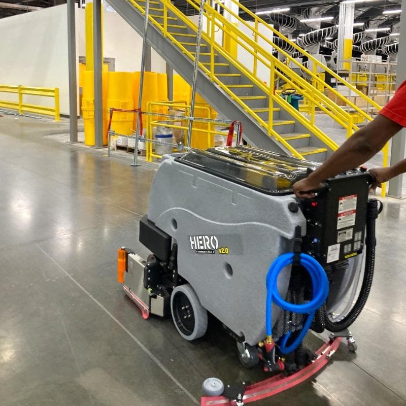 Tomcat Walk Behind Floor Scrubbers Hero production areas concrete HERO Walk Behind Floor Scrubber cleaning the densified concrete floors in the production area of a Salt Lake City, Utah chemical manufacturer