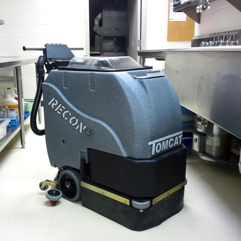 Tomcat Walk Behind Floor Scrubbers Recon kitchens epoxy RECON battery Walk Behind Floor Scrubber cleans the floor of a commercial kitchen in an Orlando,  Florida Amusement Park