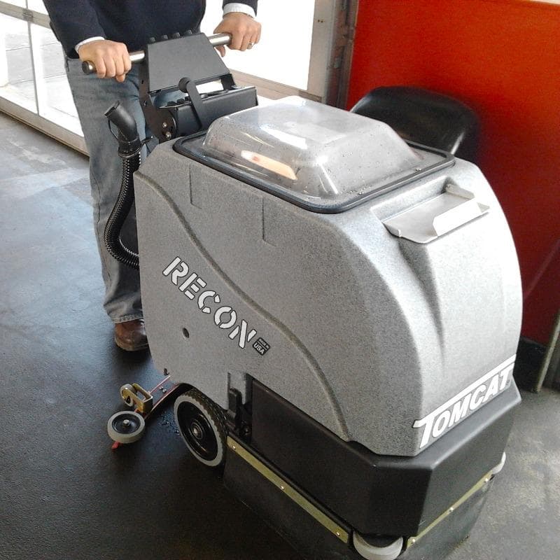 Tomcat Walk Behind Floor Scrubbers Recon service lane concrete RECON Walk Behind Floor Scrubber cleans the concrete service lanes at a Washington Quick Lube shop