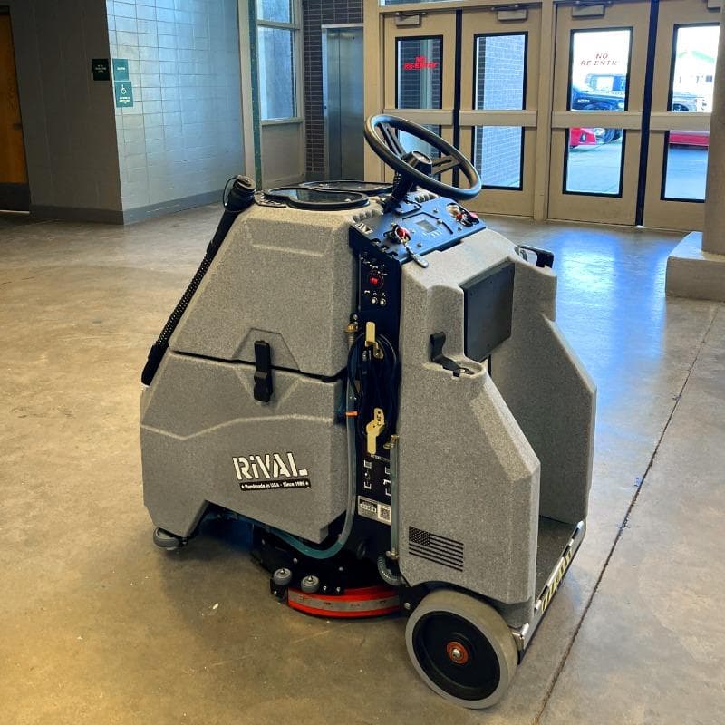 Tomcat Stand On Floor Scrubbers Rival break rooms sealed concrete A Tomcat Rival stand on battery floor scrubber has cleaned the floors of a break room at a college