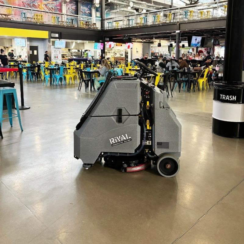 Tomcat Stand On Floor Scrubbers Rival food court concrete A Tomcat Rival stand on floor scrubber cleaning the concrete floor of a food court at a marketplace in Pittsburg, PA