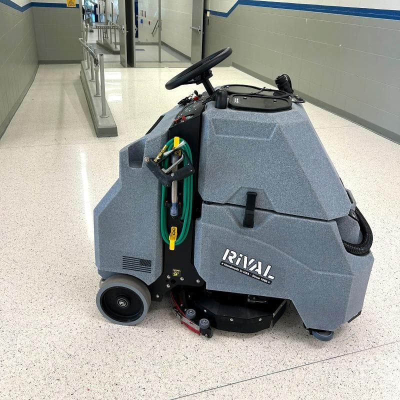 Tomcat Stand On Floor Scrubbers Rival hallways terrazzo A Tomcat Rival stand on battery floor scrubber cleaning the terrazzo floor of a hallway in , KY