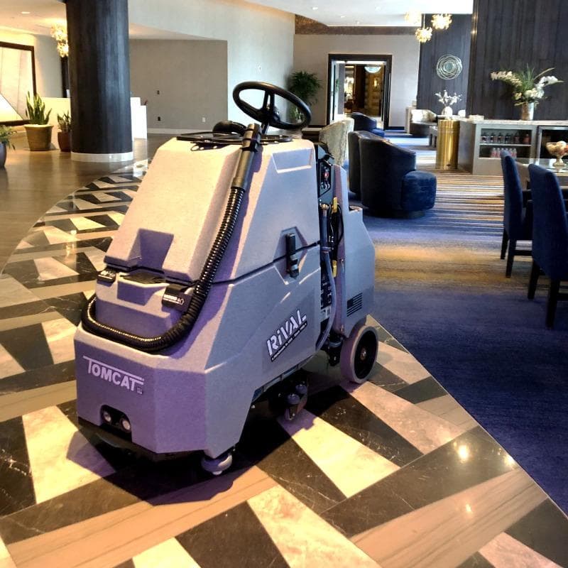 Tomcat Stand On Floor Scrubbers Rival lobby marble A Tomcat Rival stand on battery floor scrubber cleaning the marble floor of a lobby in Oklahoma City, OK