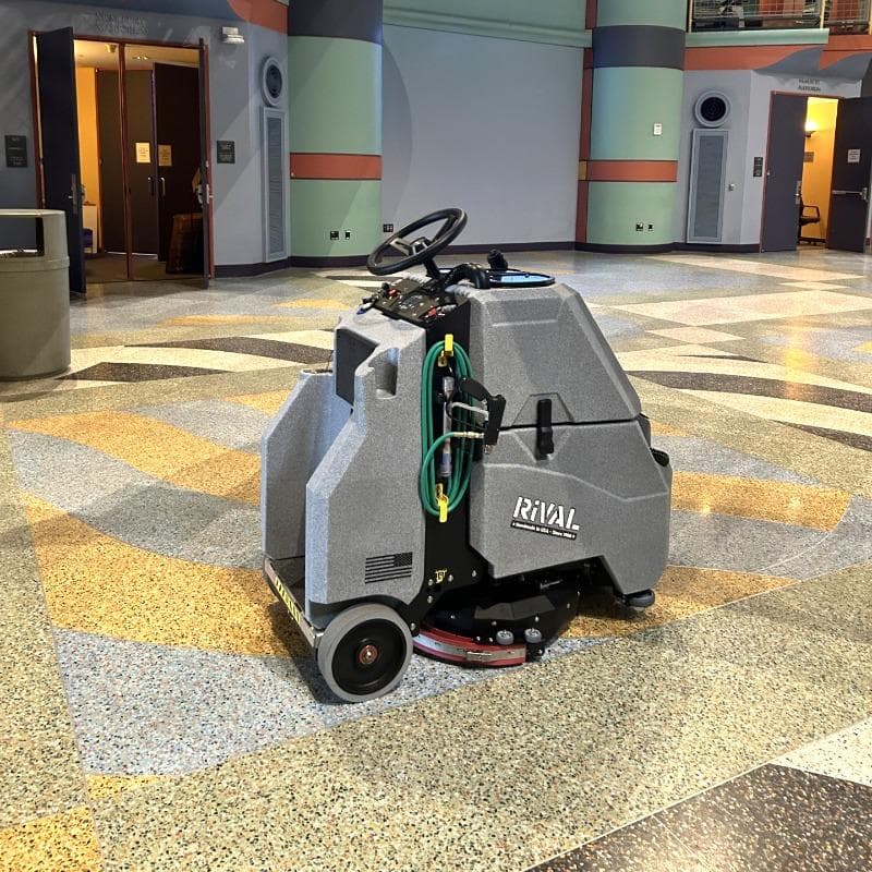 Tomcat Stand On Floor Scrubbers Rival lobby terrazzo A Tomcat Rival stand on battery floor scrubber cleaning the terrazzo floor of a entry way in Ann Arbor, MI