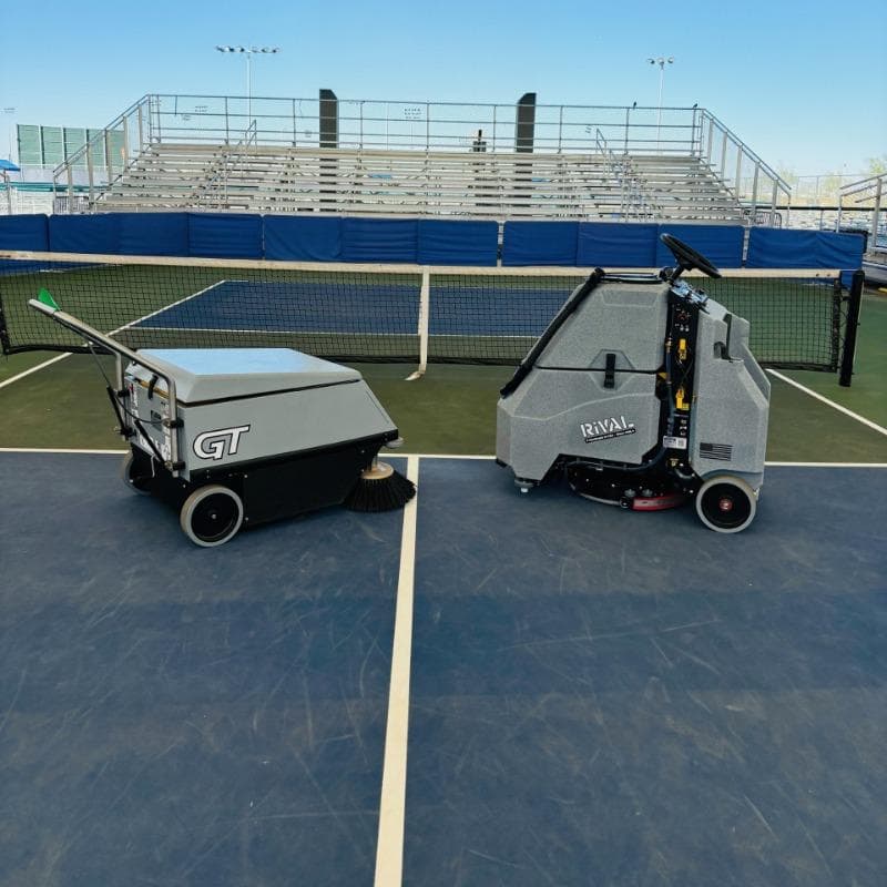 Tomcat Stand On Floor Scrubbers Rival pickleball court concrete A Tomcat Rival ultra maneuverable floor scrubber clean an outdoor pickleball court in Arizona.