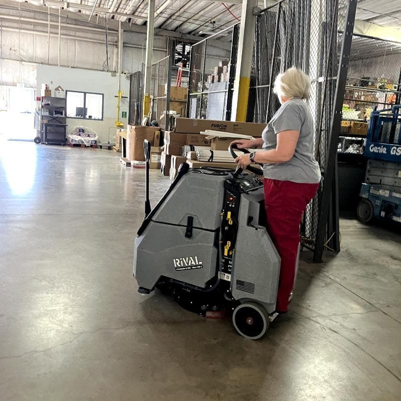 Tomcat Stand On Floor Scrubbers Rival service department concrete A Tomcat Rival stand on battery floor scrubber cleaning the concrete floor of a service facility in Charleston, SC