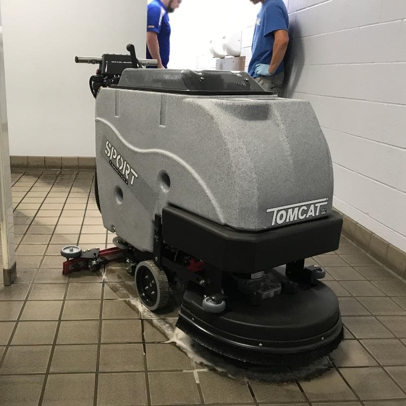 Tomcat Walk Behind Floor Scrubbers Sport bathroom tile floors SPORT Walk Behind battery Floor Scrubbers cleans the tile floor in the restroom of an Atlanta Georgia Fabrication Shop