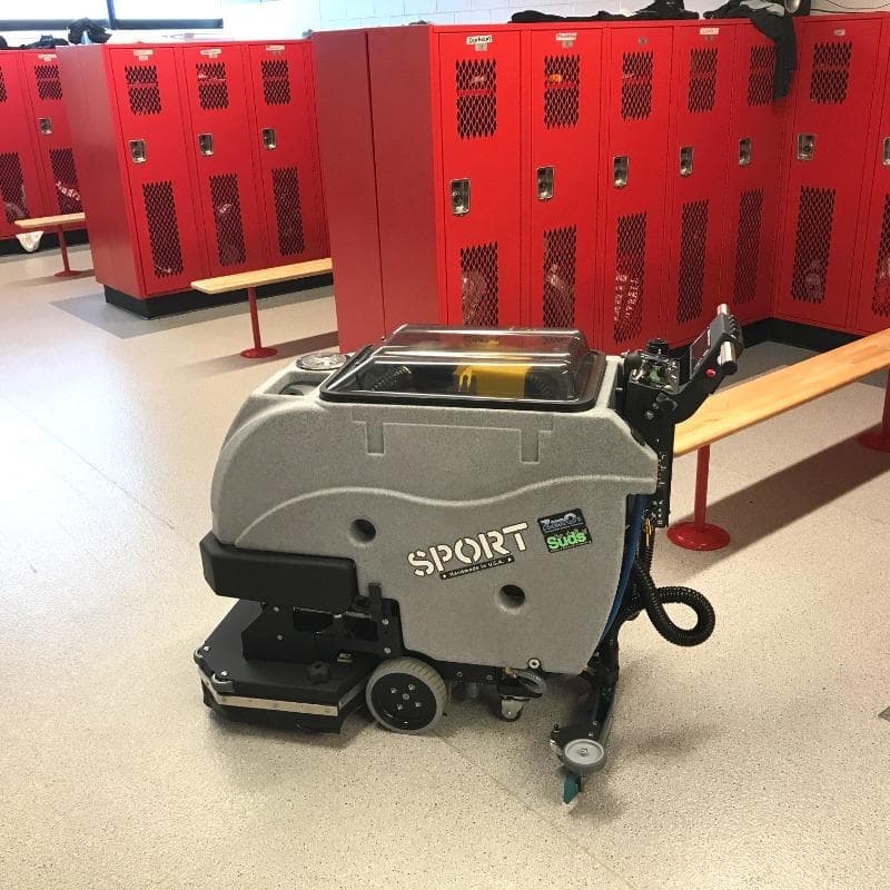Tomcat Walk Behind Floor Scrubbers Sport locker room epoxy-coated SPORT walk behind floor scrubber cleans the epoxy coated floors in the locker room of a Kansas City, Missouri health club