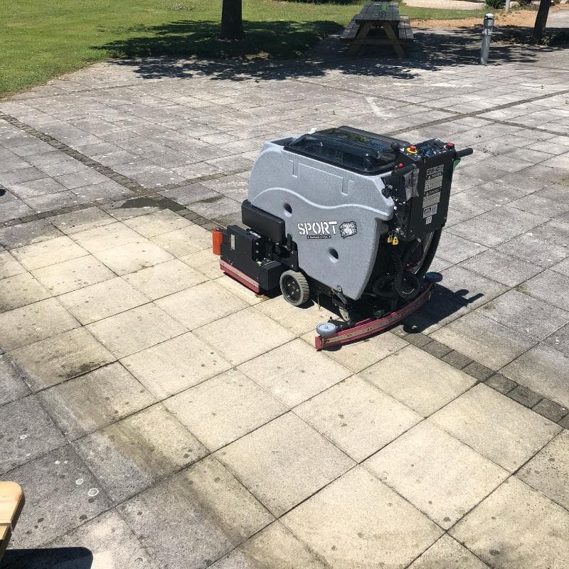 Tomcat Walk Behind Floor Scrubbers Sport patio paver floors SPORT Battery Walk Behind Floor Scrubber cleaning a paver patio at a Cocoa, Florida country club.