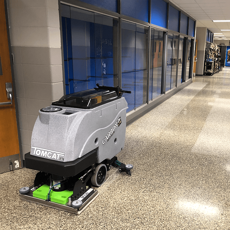 Tomcat floor scrubber showcasing its cleaning power