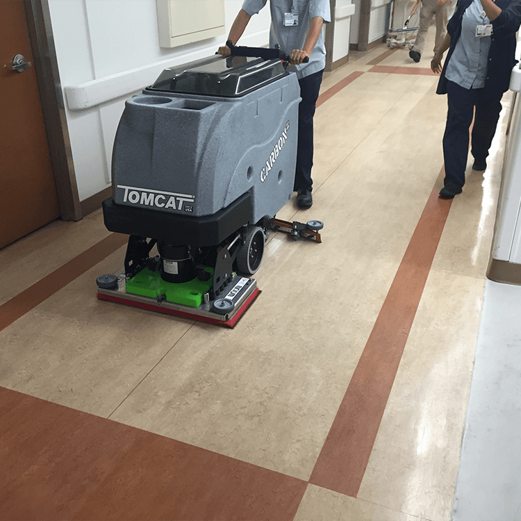 Tomcat floor scrubber showcasing its cleaning power